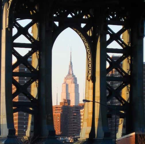 Empire State Building framed by Manhattan Bridge, New York City