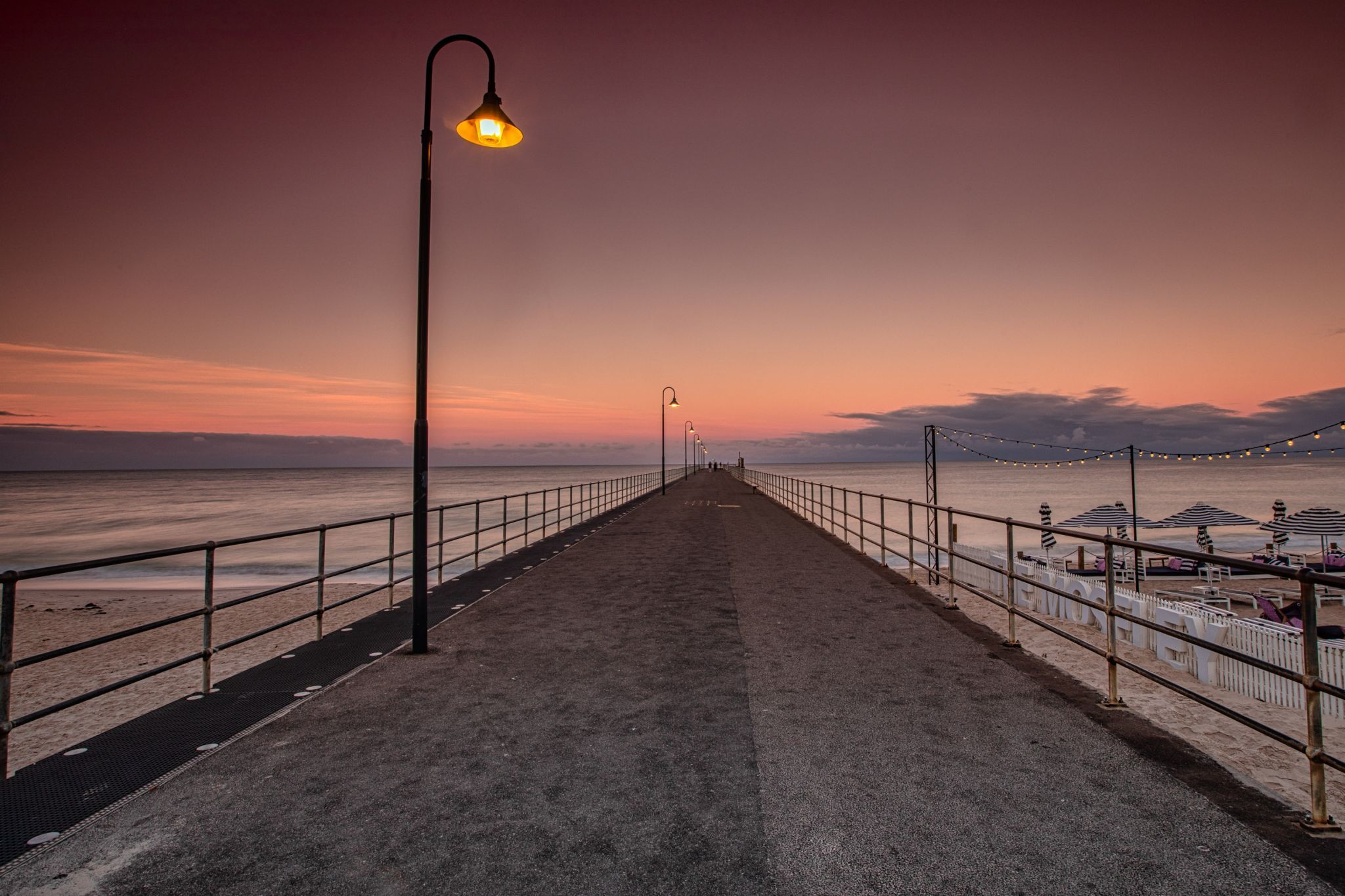 Looking down Glenelg Pier Sunrise, Adelaide, Australia