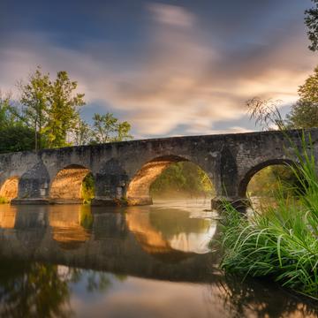Ancient stone bridge over the Altmuehl River at Pfuenz, Germany