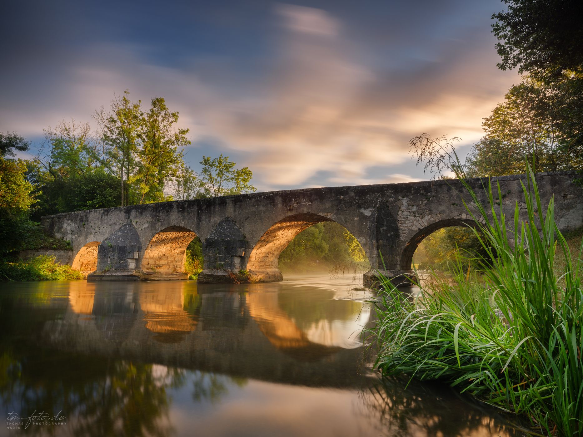Ancient stone bridge over the Altmuehl River at Pfuenz, Germany