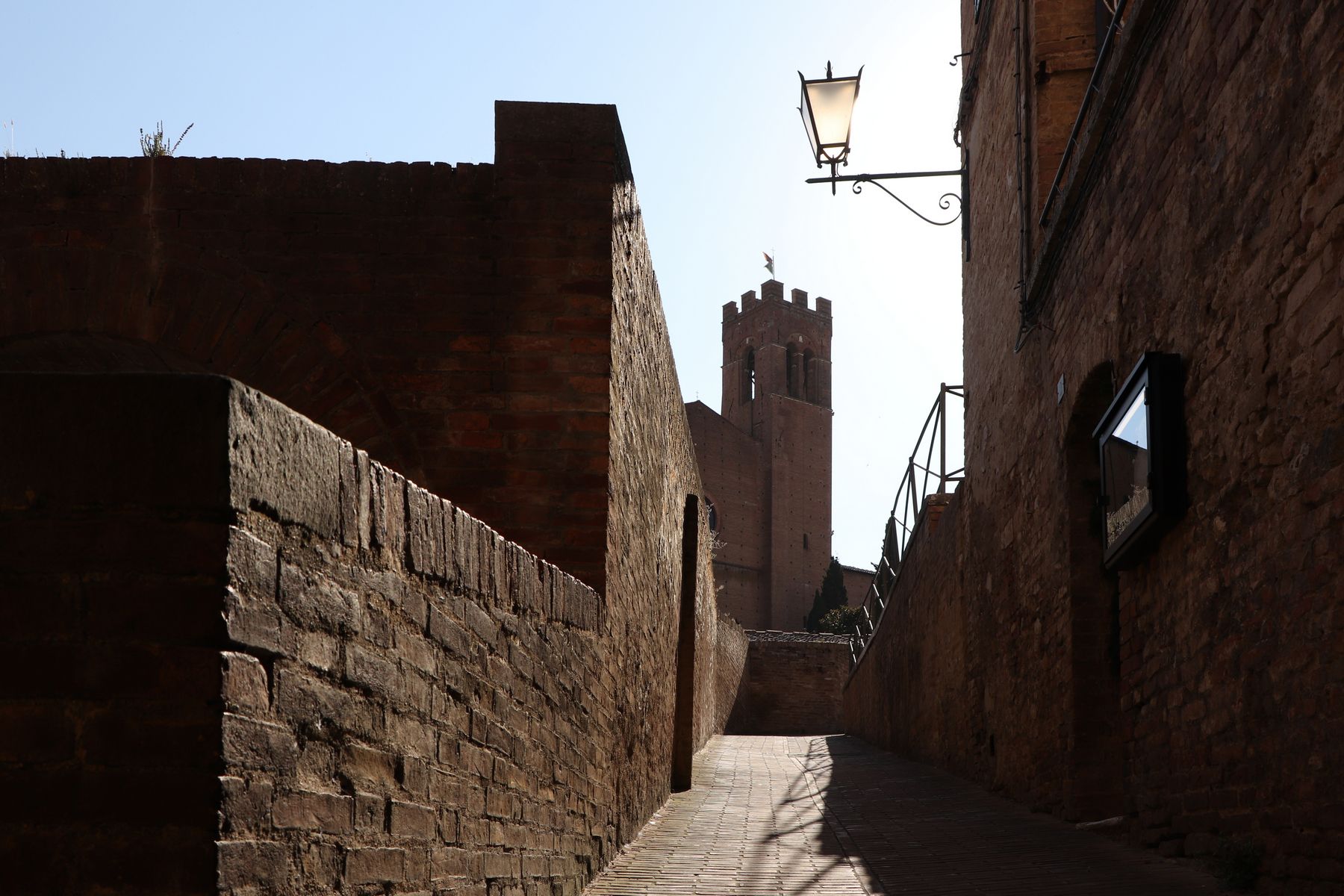 Medieval alley with a view of the Basilica di San Domenico, Italy