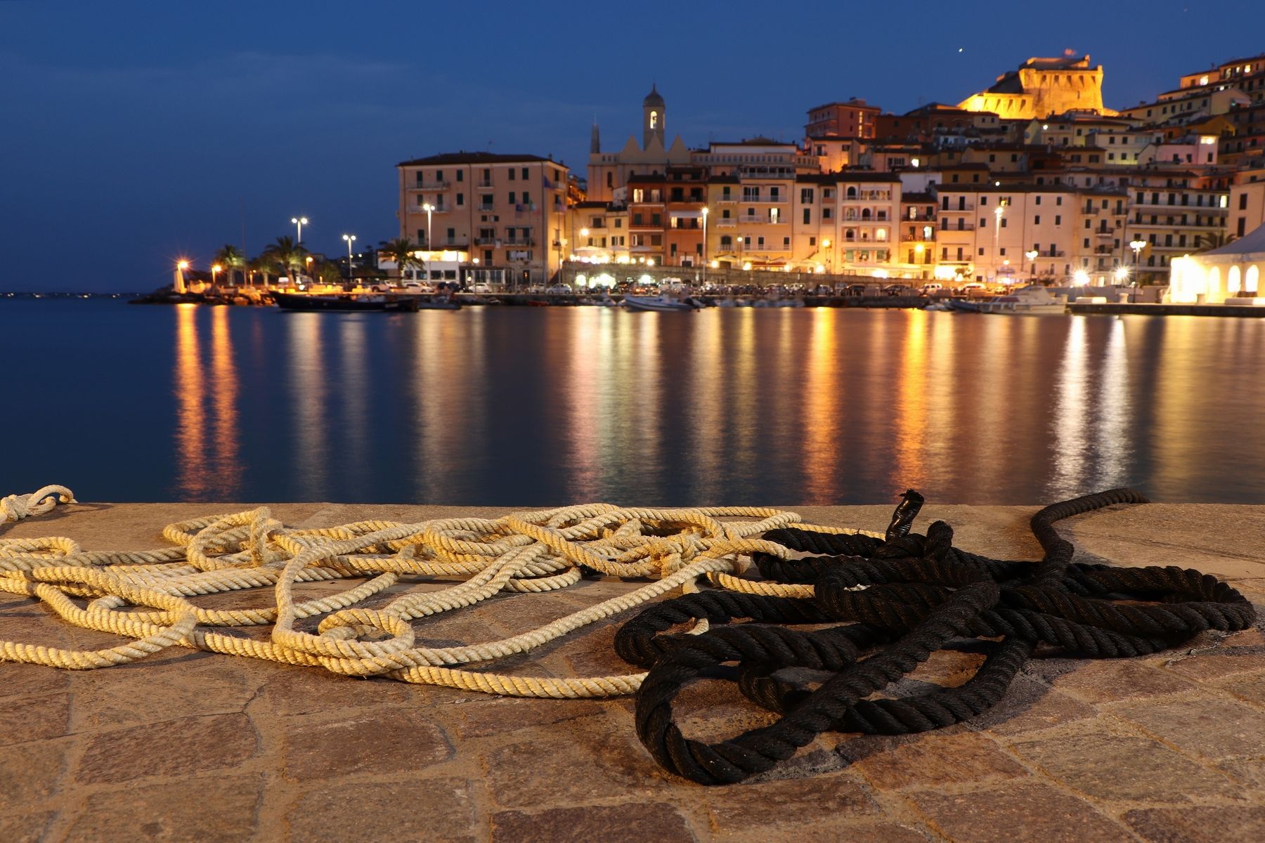 View of the old town of Porto Santo Stefano from the harbour, Italy