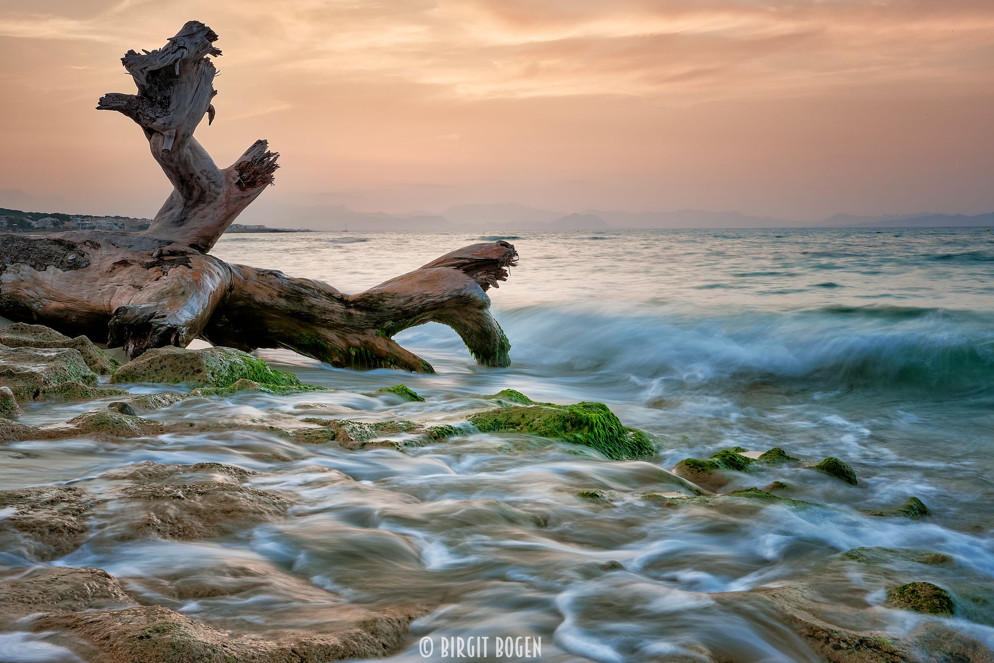 Sunset at the beach of Son Serra de Marina, Spain