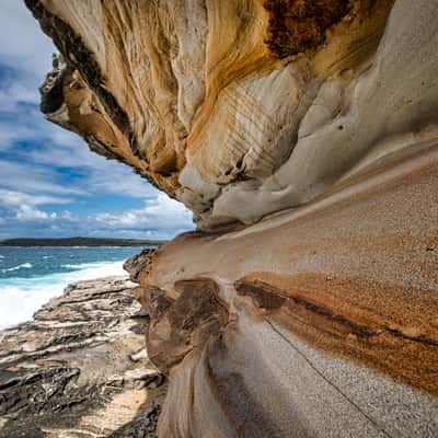 Sandstone coloured cliff face Maroubra, Sydney, NSW, Australia