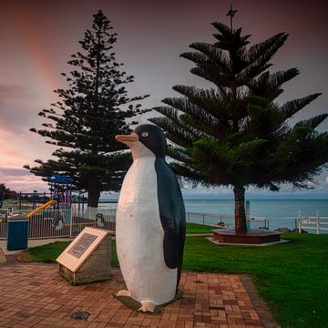 Statue of a penguin at sunset, Penguin, Tasmania, Australia