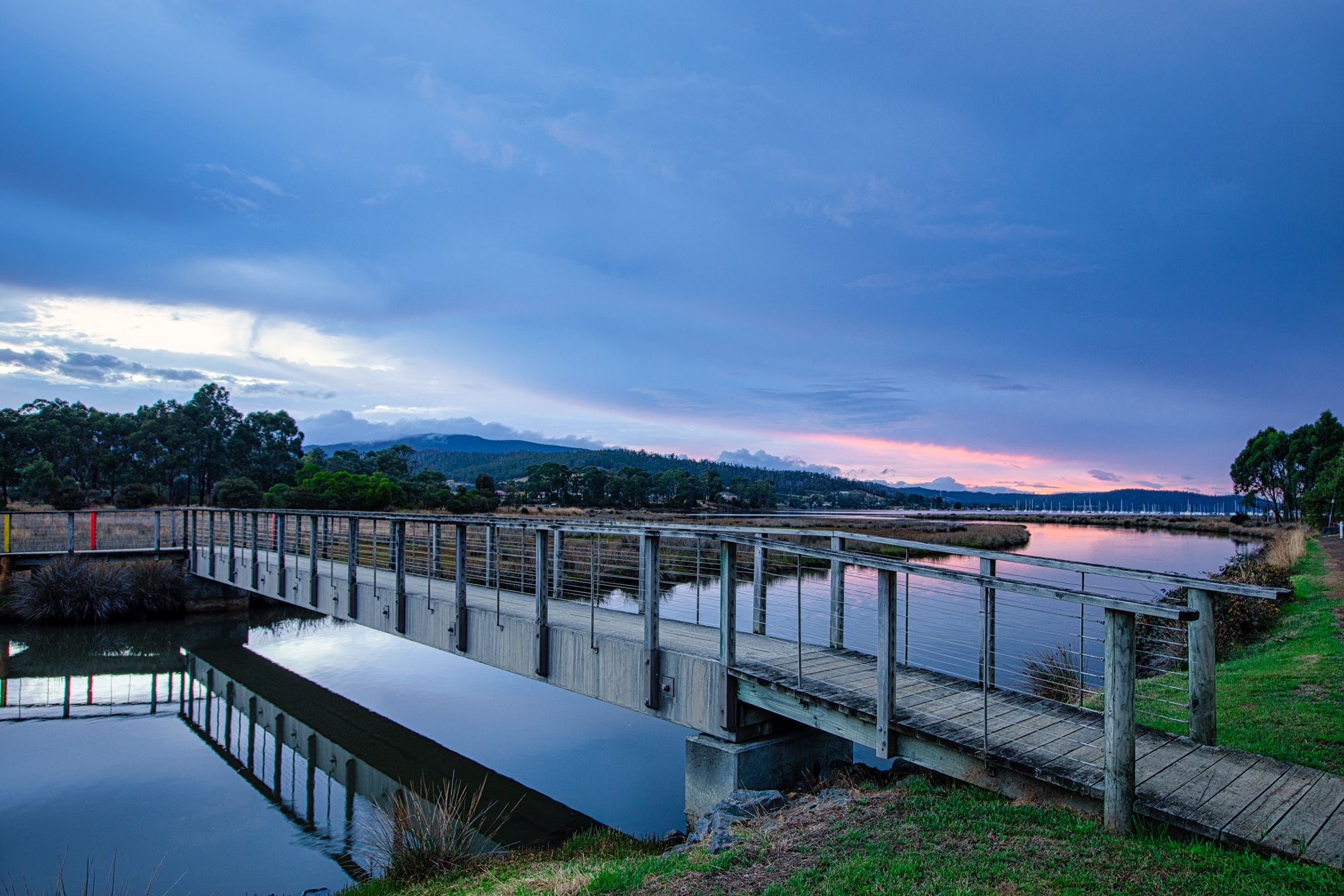 Walking bridge reflection sunrise, Cygnet, Tasmania, Australia
