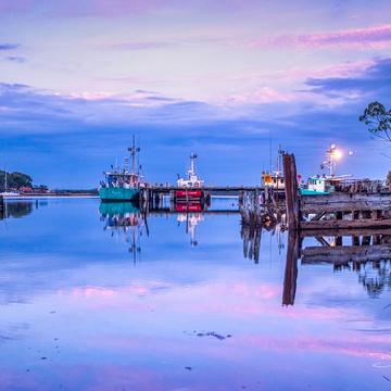 Risby Cove Fishing boats sunrise Strahan, Tasmania, Australia