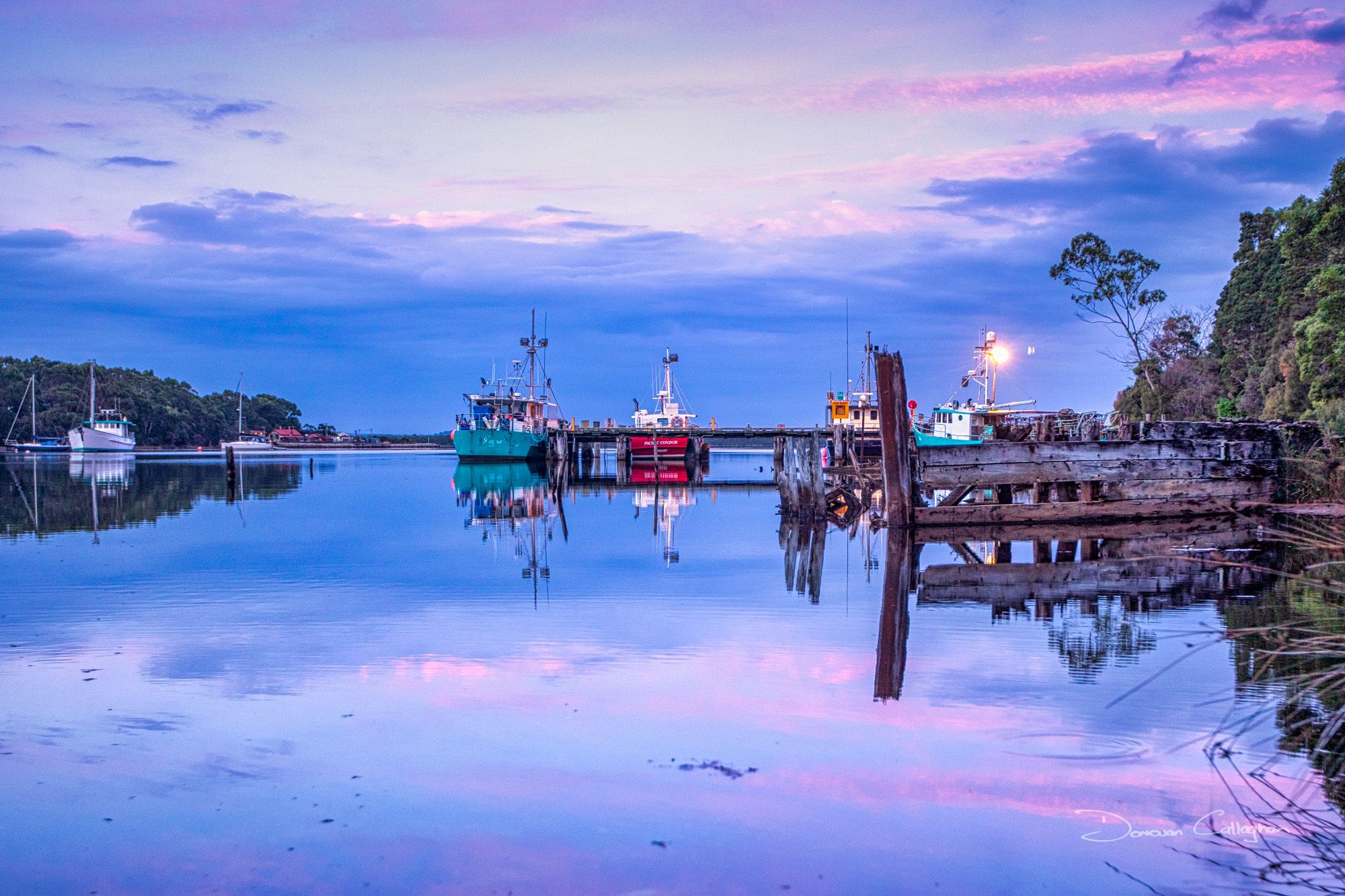 Risby Cove Fishing boats sunrise Strahan, Tasmania, Australia