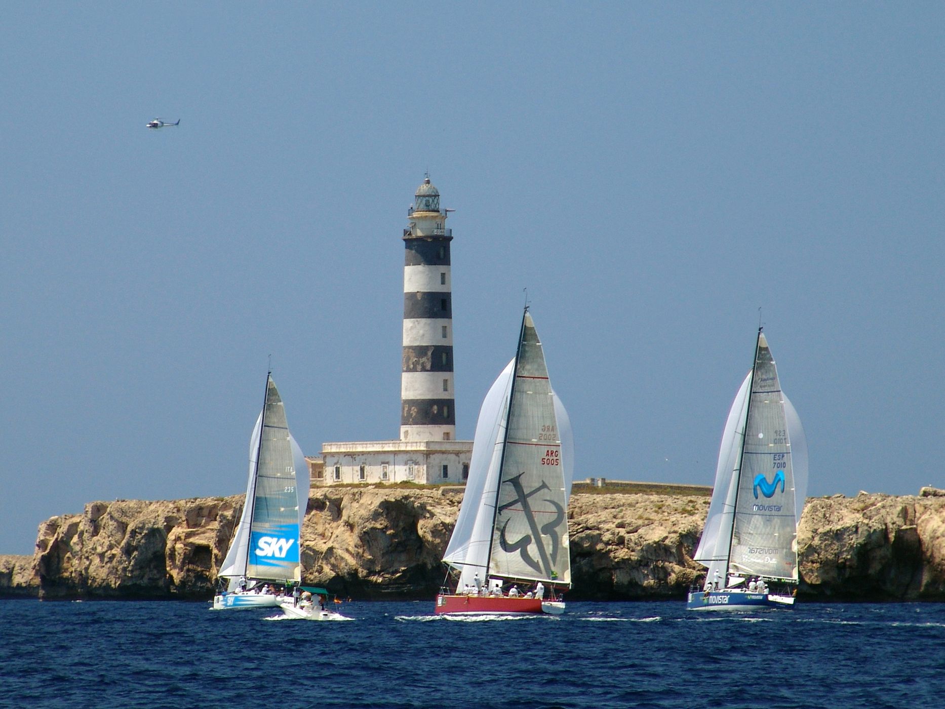 Regatta near Lighthouse, Spain