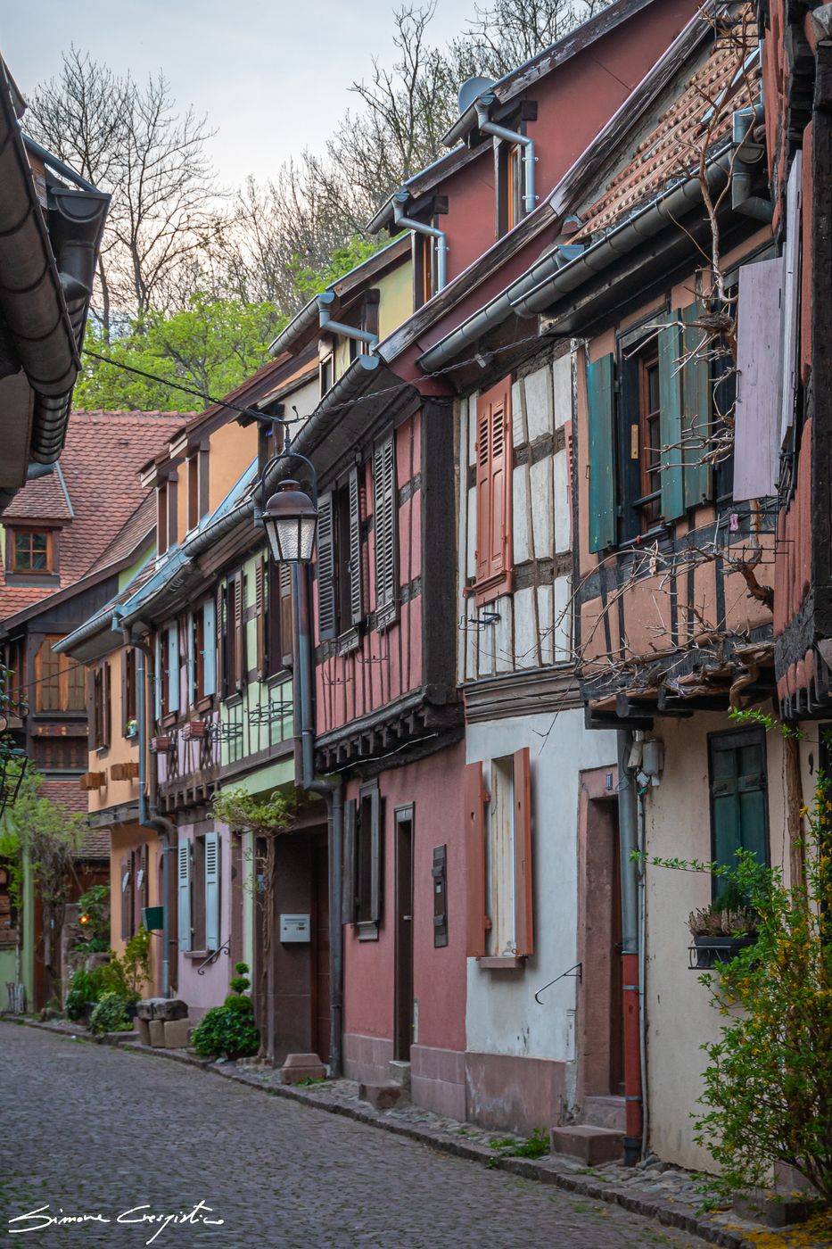 Alley with traditional alsatian houses in Kaysersberg, France