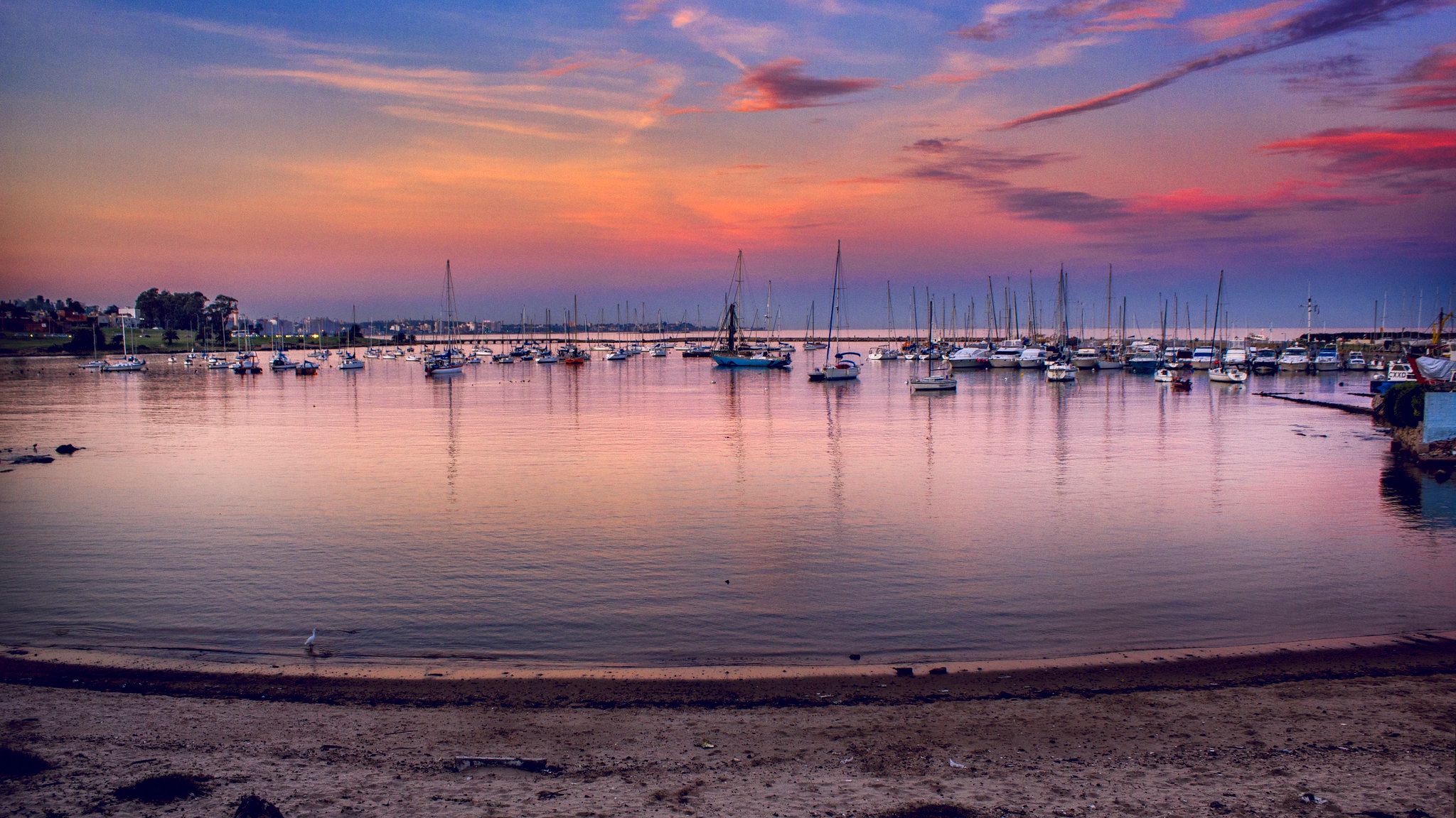 Beach in front of a little  nautical harbor, Uruguay