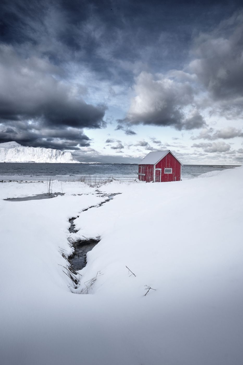 Red hut at Ramberg beach, Lofoten, Norway