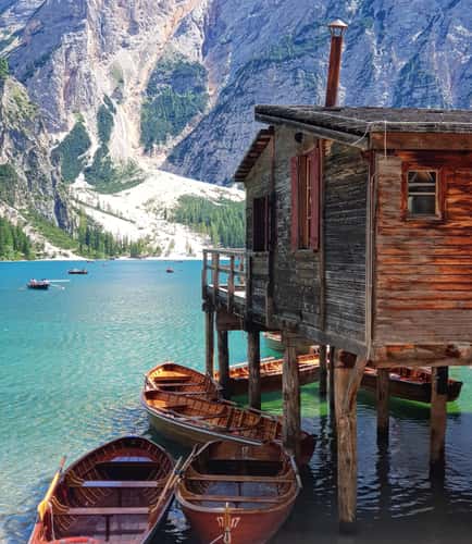 Wooden house on Lago Braies in Dolomites