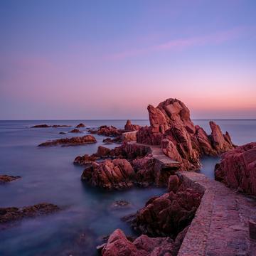 Evening view of the bridge on the rocks of Canyet de Mar, Spain
