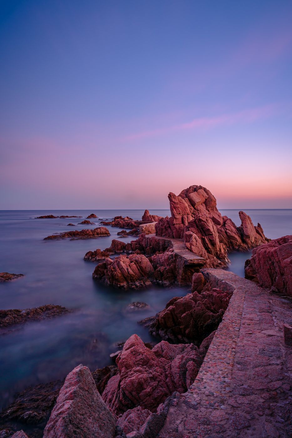 Evening view of the bridge on the rocks of Canyet de Mar, Spain