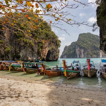 Long tail boats at Thai beach, Thailand