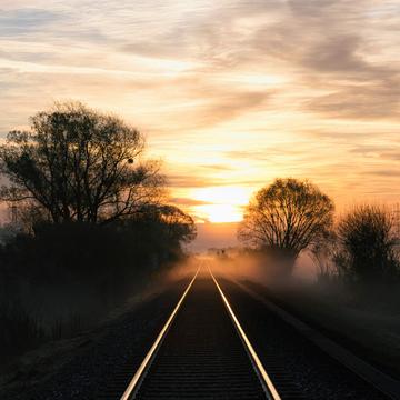 Railroad tracks at sunrise, Austria