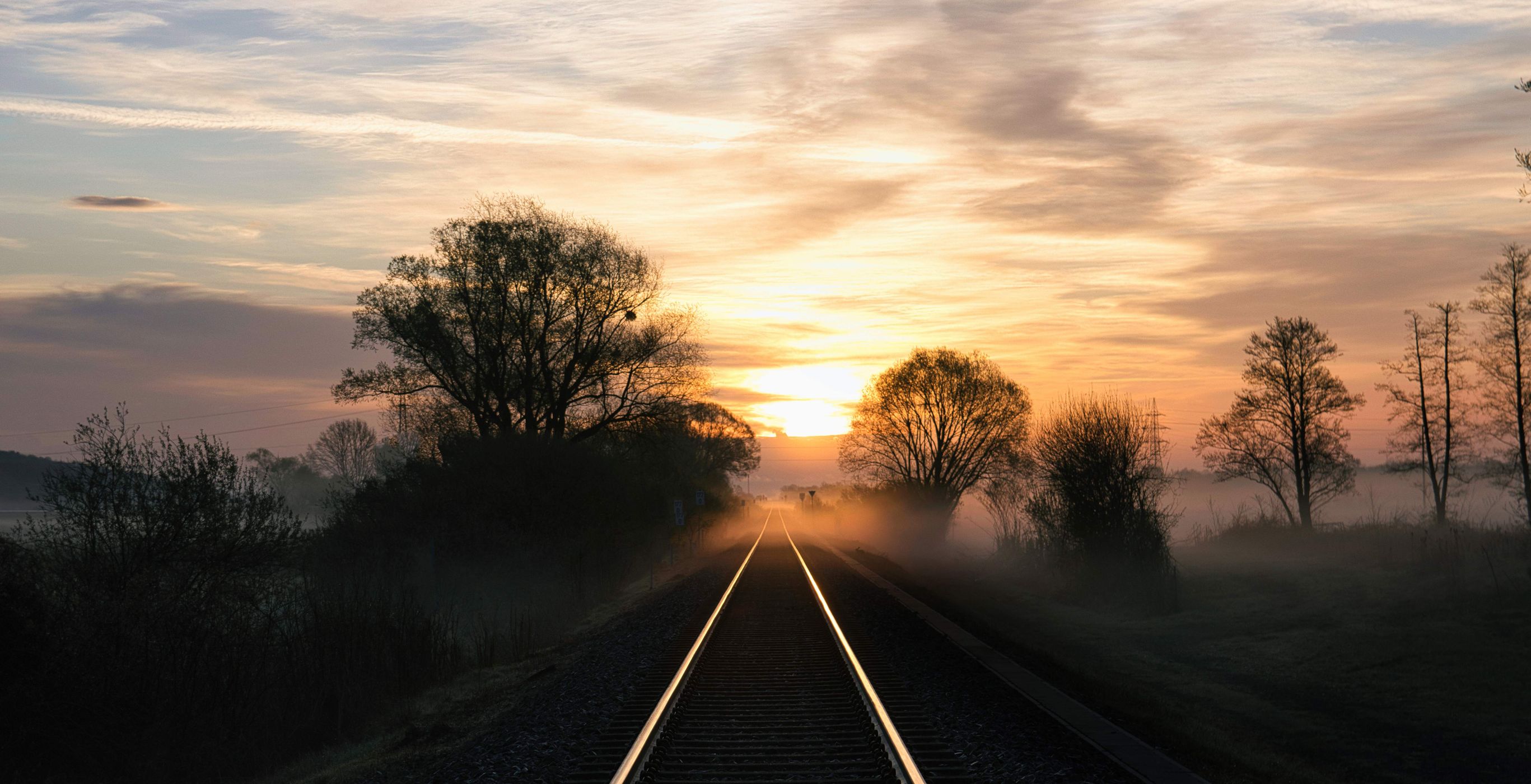 Railroad tracks at sunrise, Austria