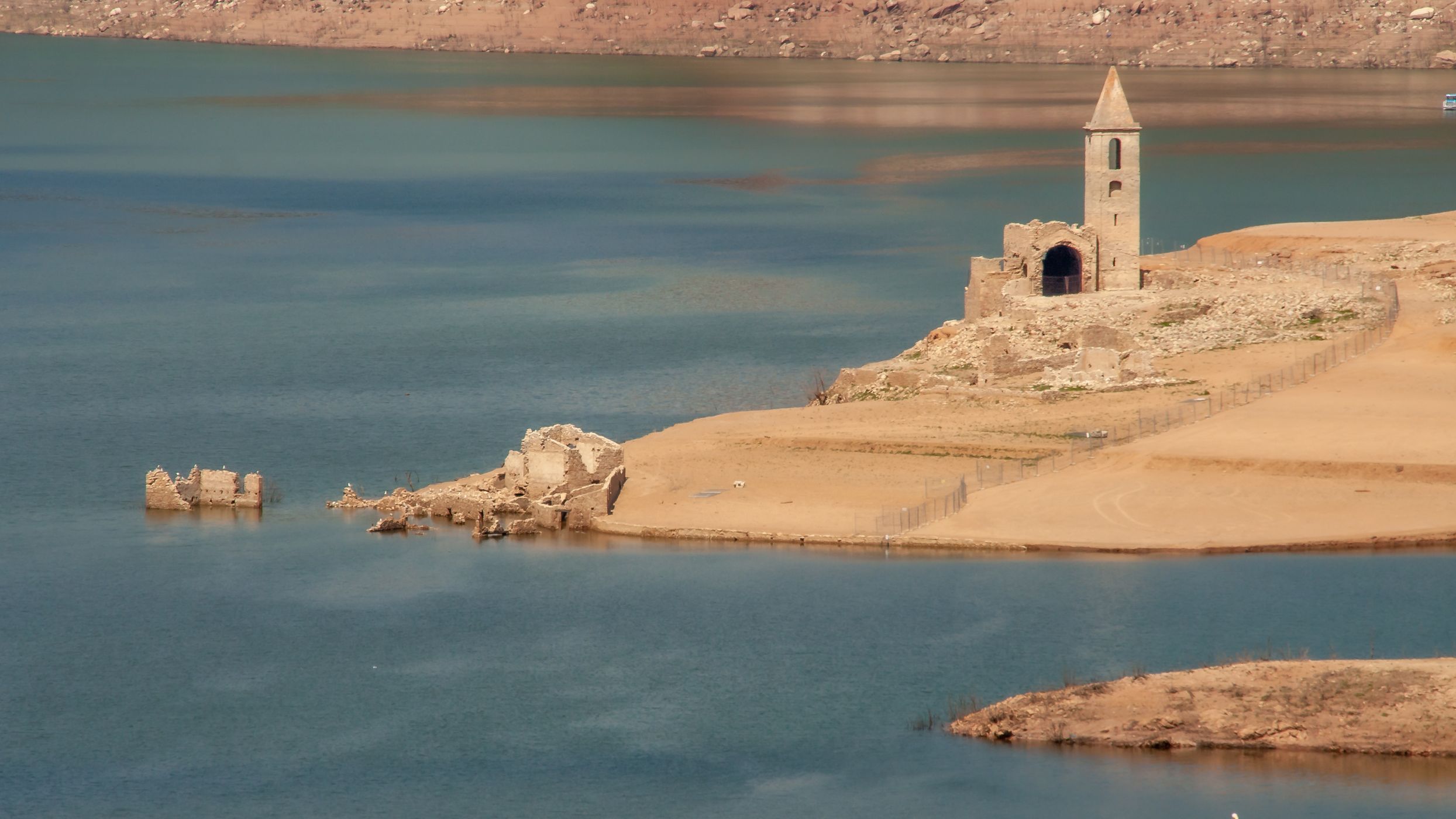 Church of Sant Roma de Sau seen from the shore, Spain