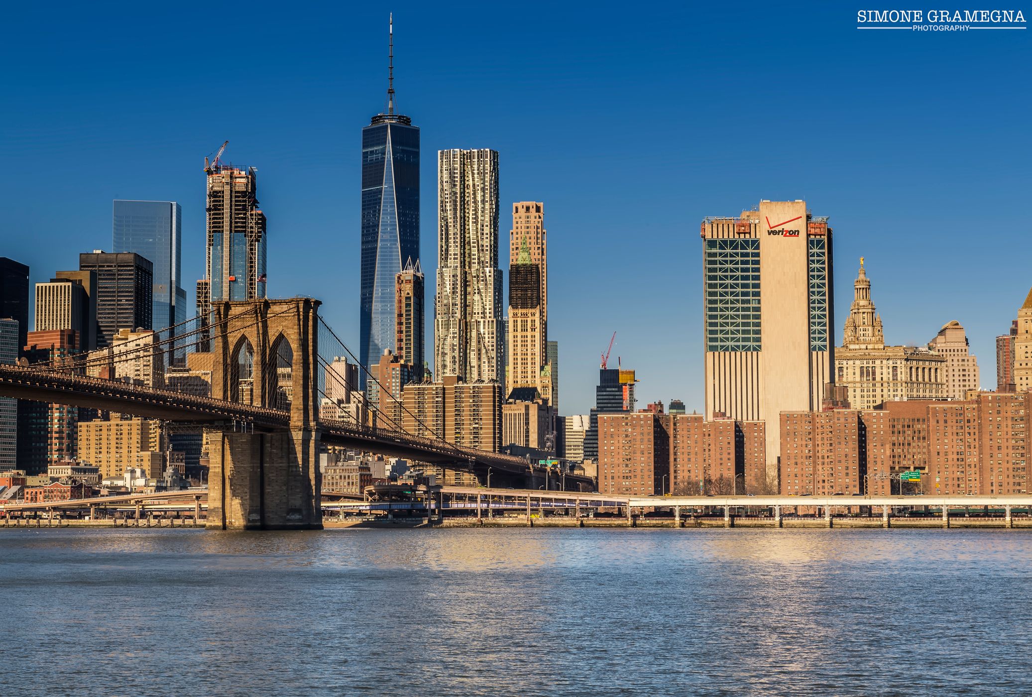 Brooklyn Bridge skyline from Pebble Beach, New York City, USA