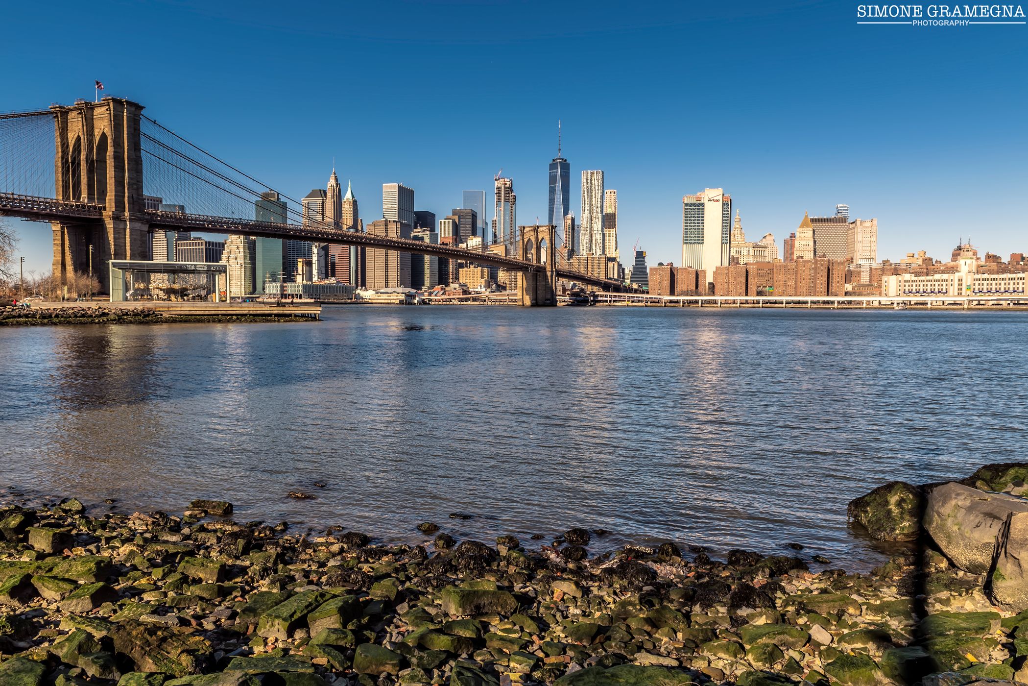 Brooklyn Bridge skyline from Pebble Beach, New York City, USA