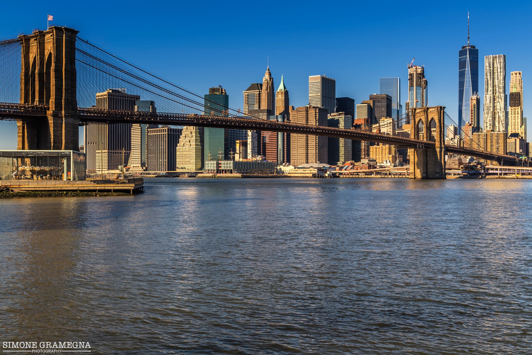 Brooklyn Bridge skyline from Pebble Beach, New York City, USA