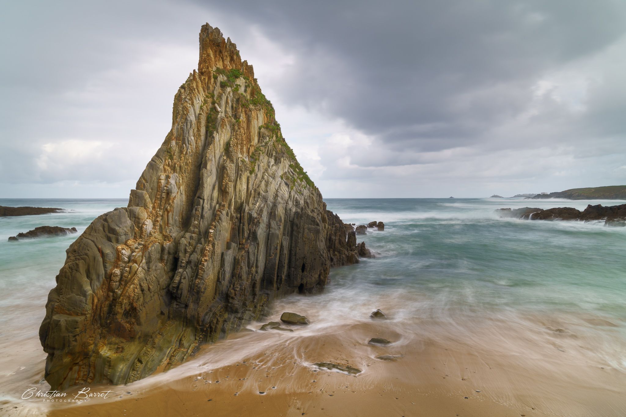 Triangular Rock at Playa de Mexota, Spain