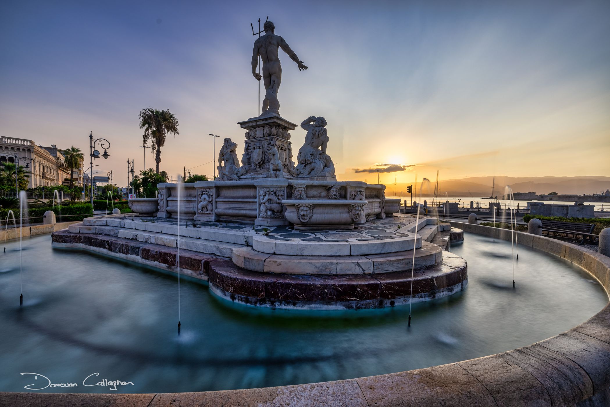 Sunrise The Neptune fountain of Messina, Italy