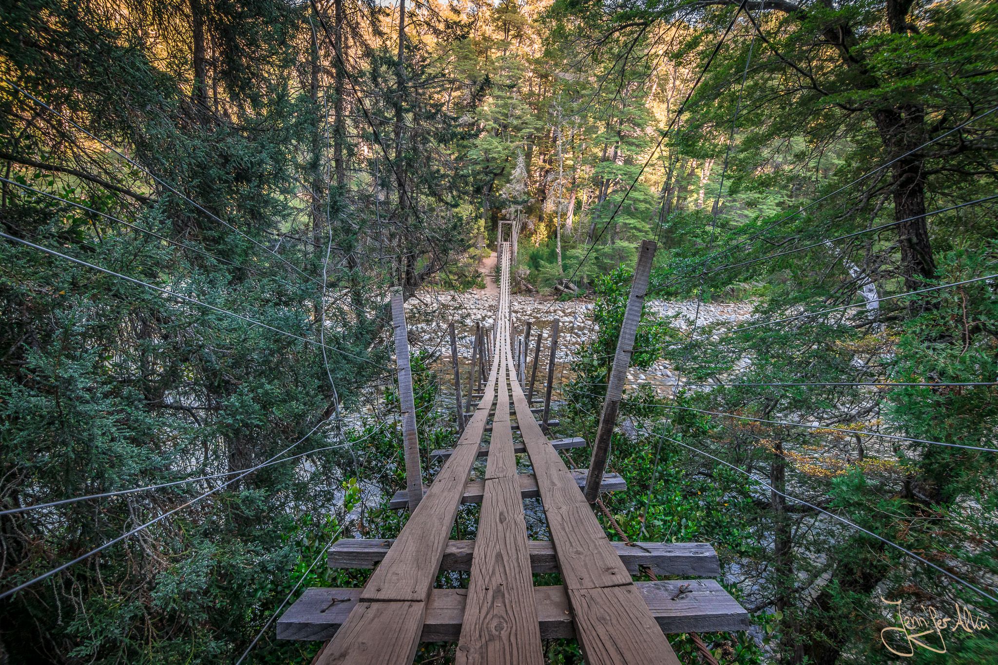 Suspension bridge over the Rio Azul near El Bolson, Argentina