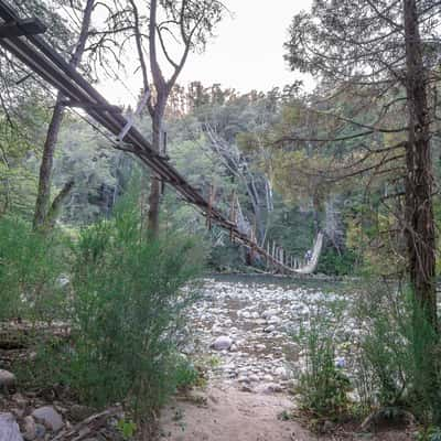 Suspension bridge over the Rio Azul near El Bolson, Argentina