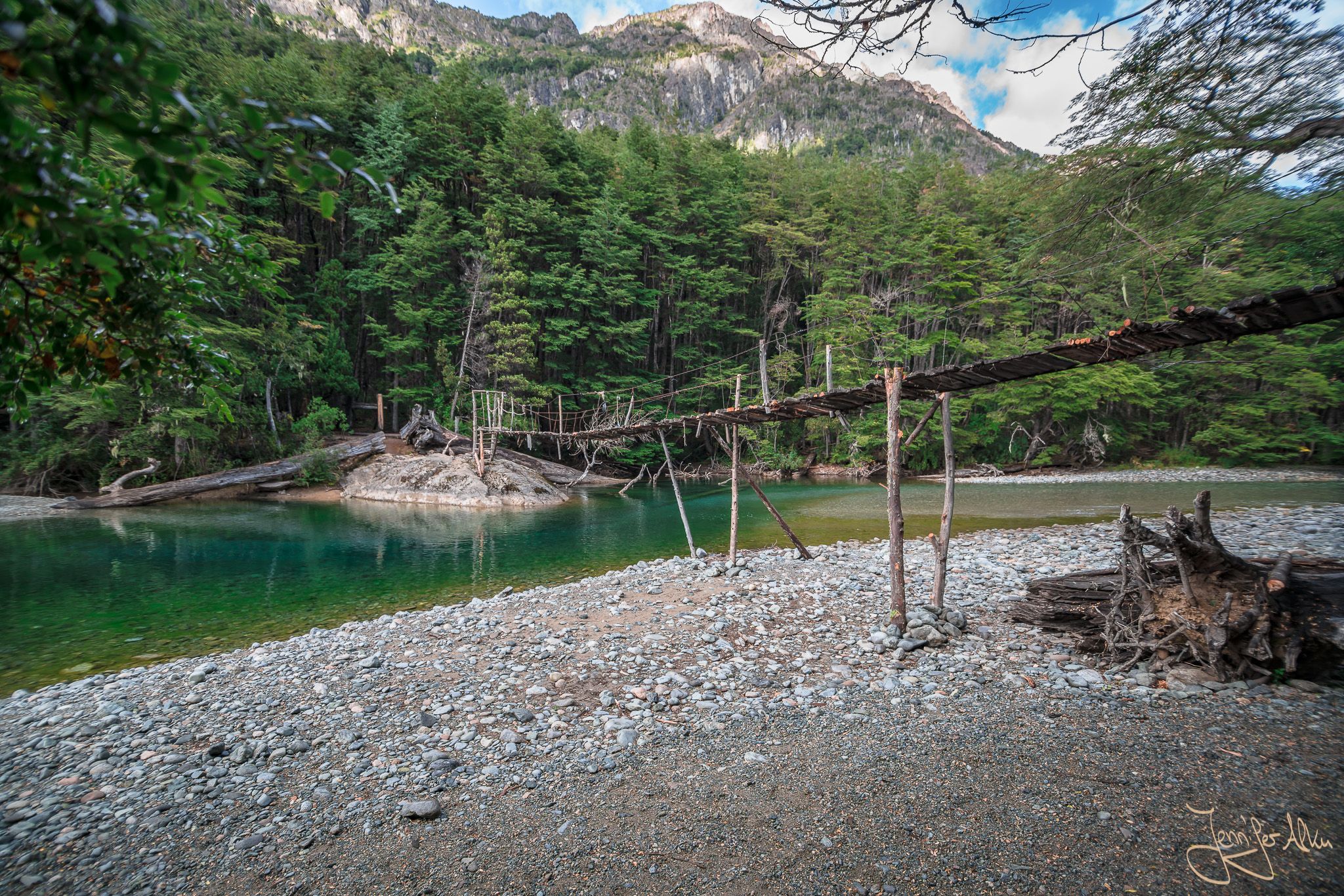 Wooden bridge over river Rio Azul, El Bolson, Argentina