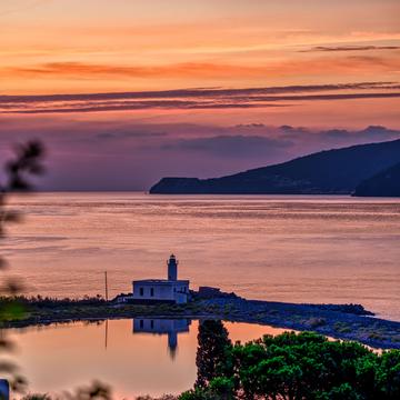 Flowers lighthouse Lingua, Salina, Aeolian Islands, Italy