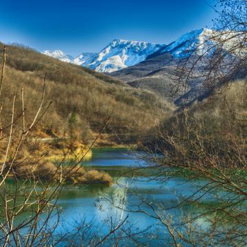 Provenzano Lake, view of the top of Gran Sasso, Italy