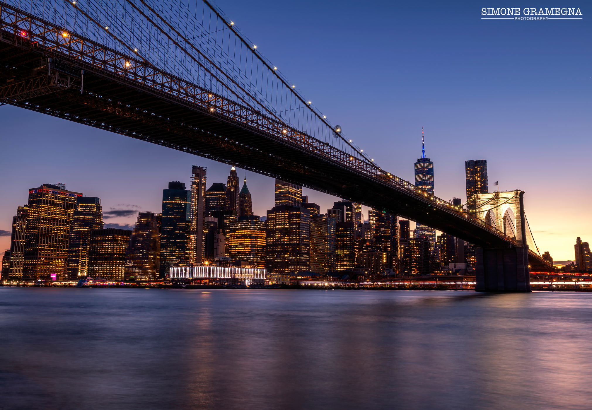 Brooklyn Bridge skyline from Pebble Beach, New York City, USA
