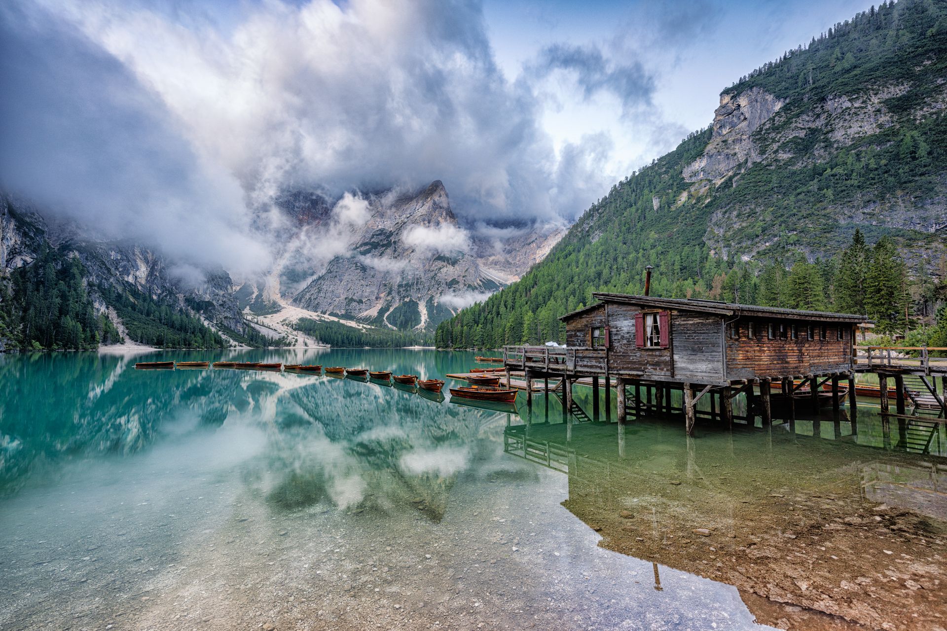 Wooden house on Lago Braies in Dolomites, Italy