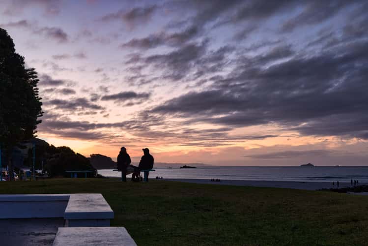couple sunset Mount Maunganui, North Island
