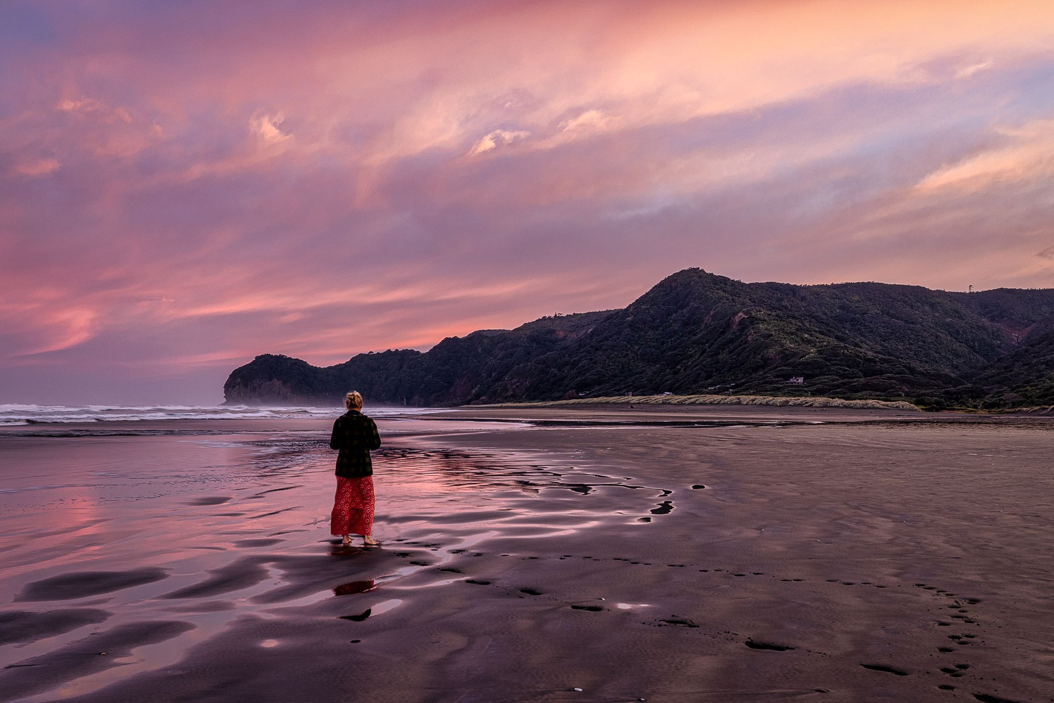 lady on beach sunrise, Piha Beach, Piha, North Island, New Zealand