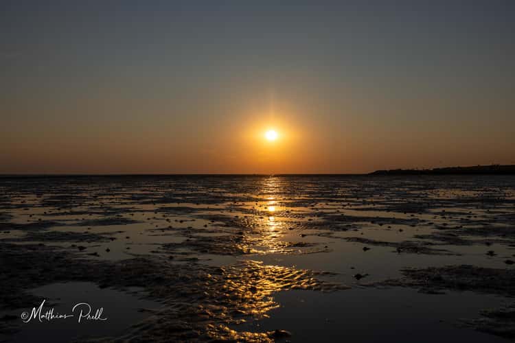 Sonnenuntergang im Watt vor Büsum