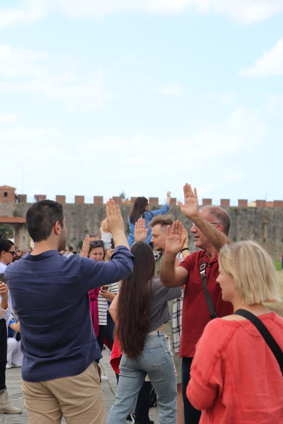 People taking pictures at Leaning Tower of Pisa, Italy