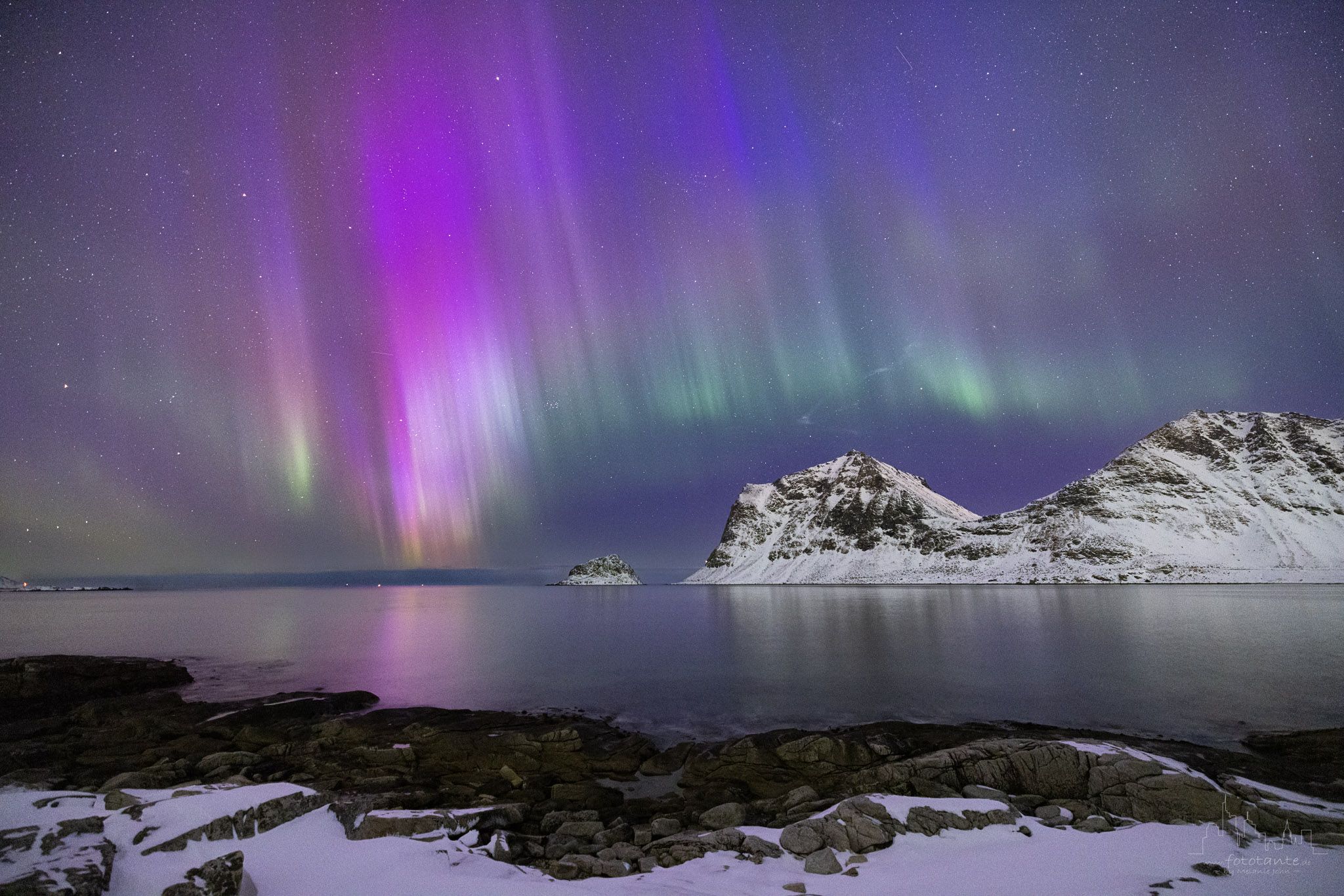 Polar light over Vik Beach and Haukland Beach, Norway