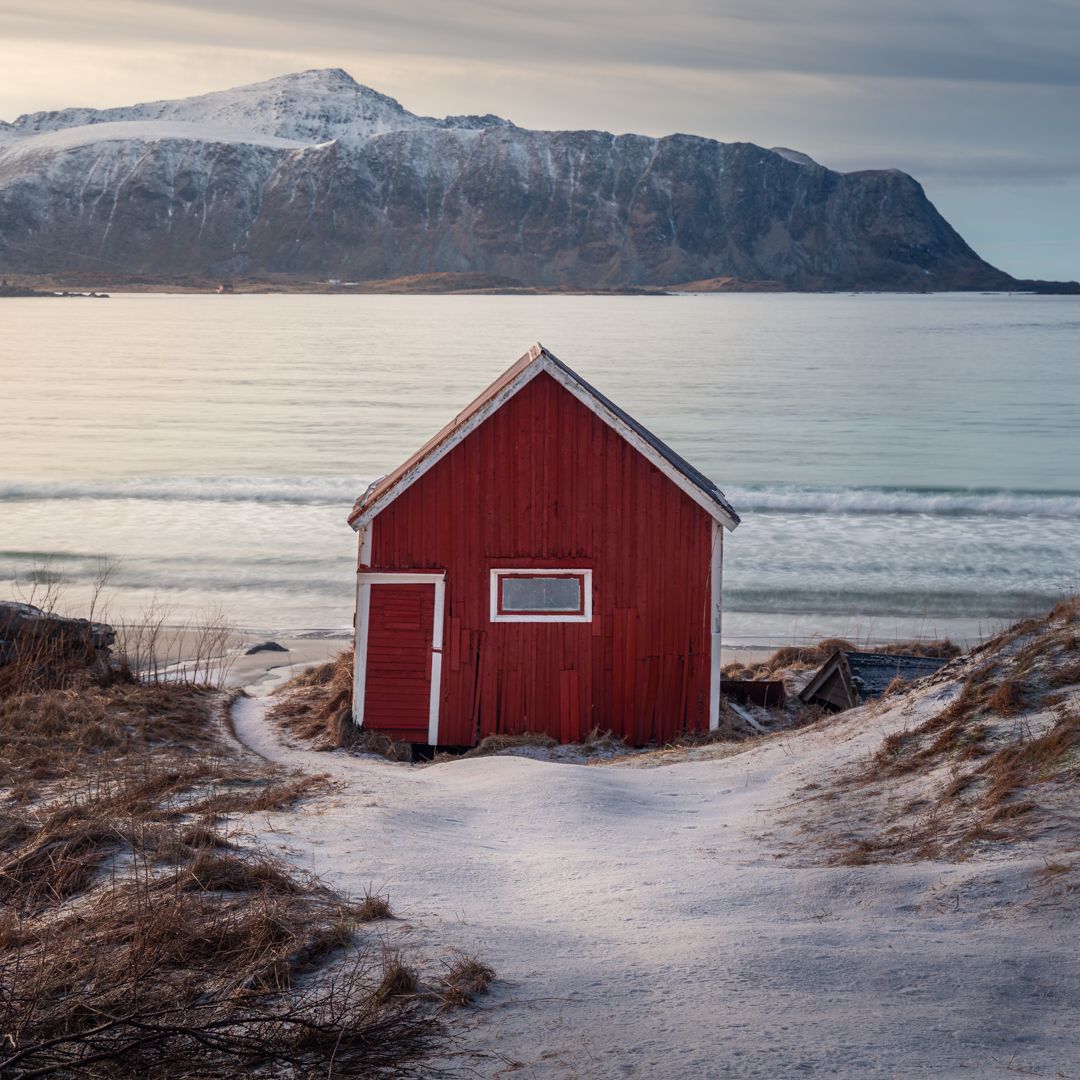 Red hut at Ramberg beach, Lofoten, Norway
