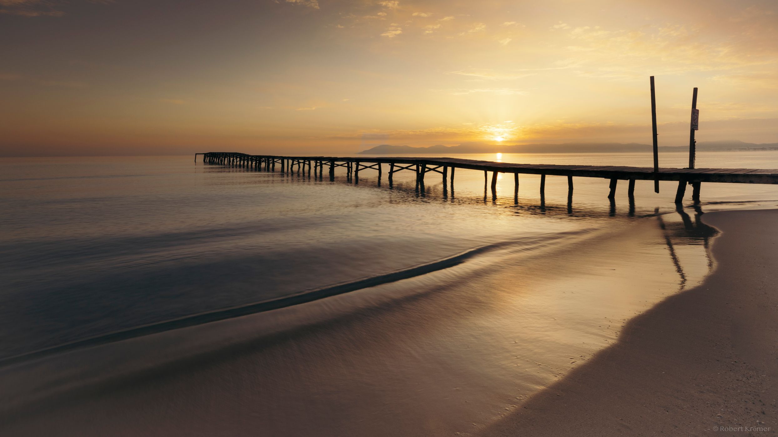 Wooden walkway at Playa de Muro from the side, Spain
