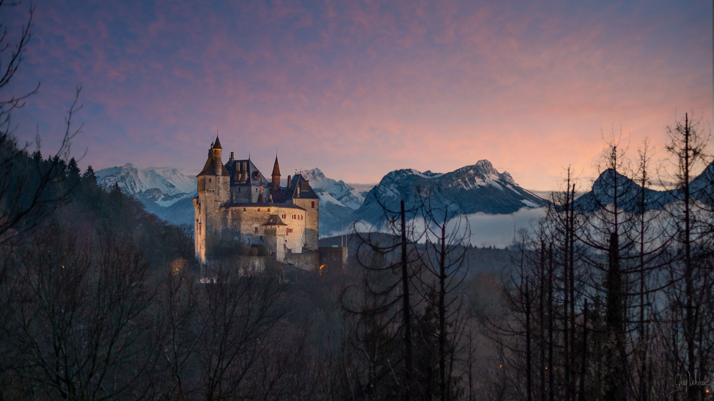 Chateau de Menthon Saint Bernard au coucher de soleil, France