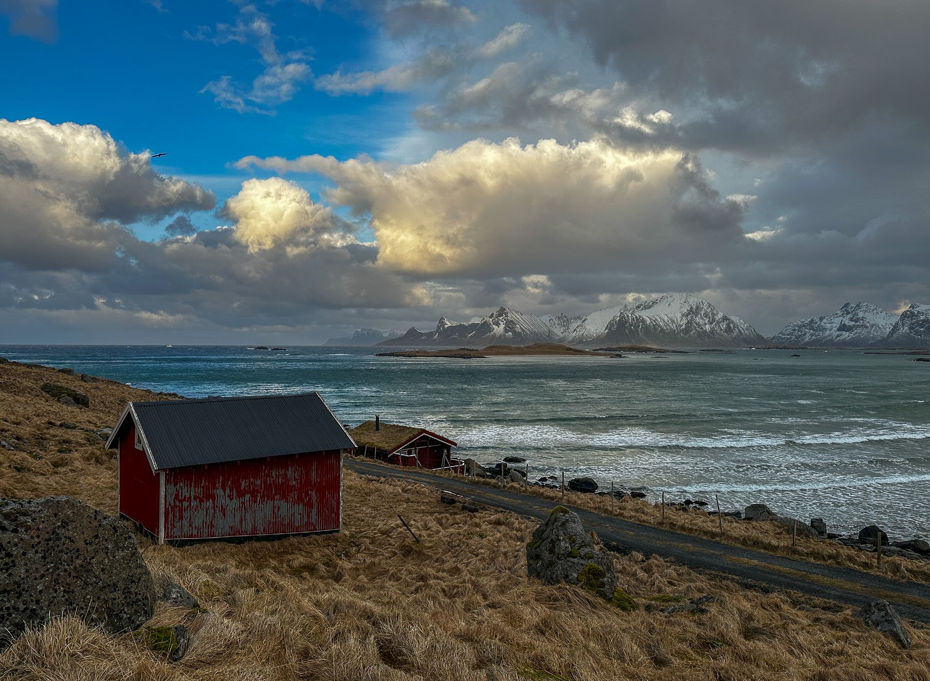 Beach houses with a view of Sandøya, Lofoten, Norway