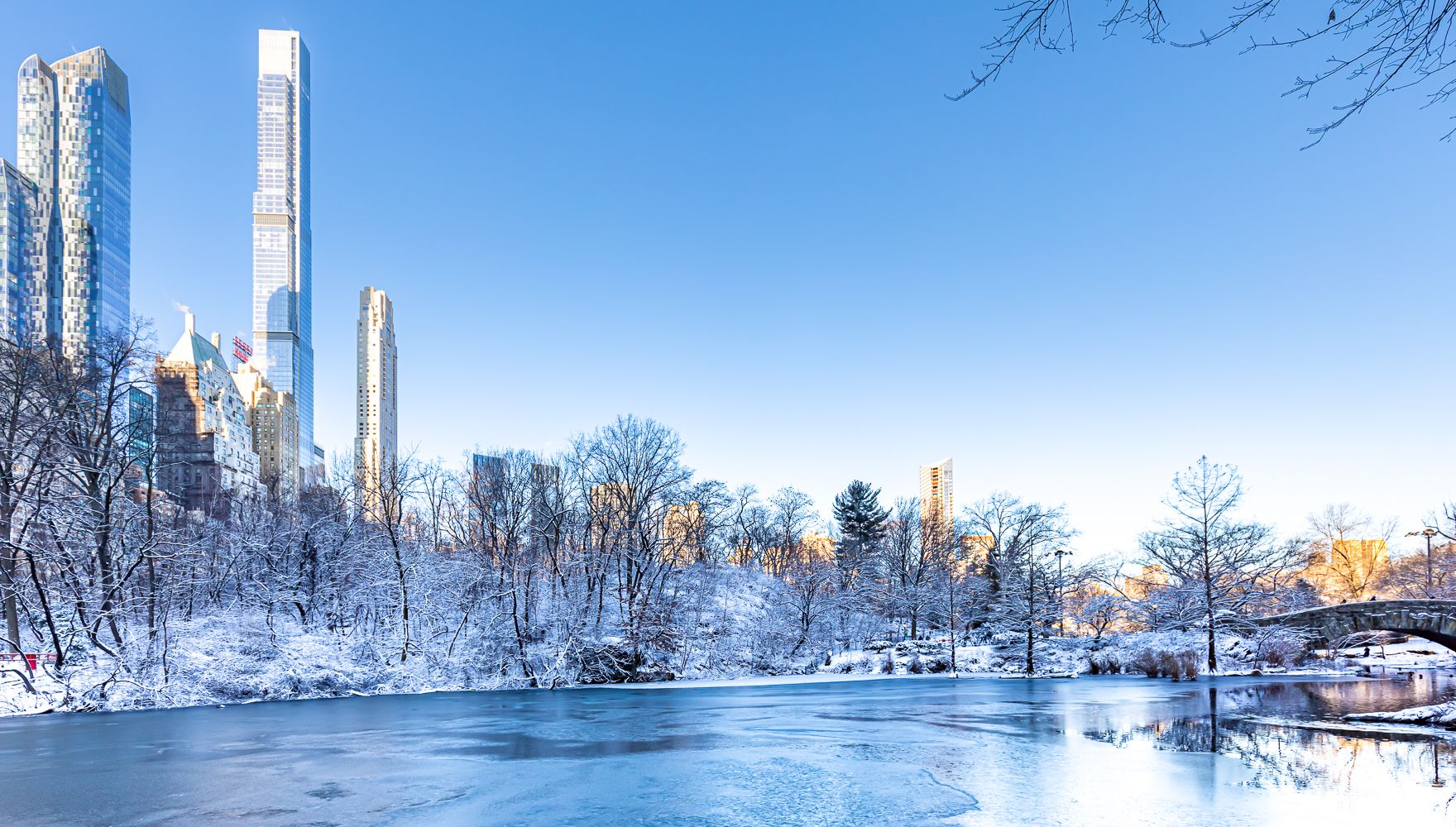 Winter Manhattan skyline reflects in the Central Park Pond, USA