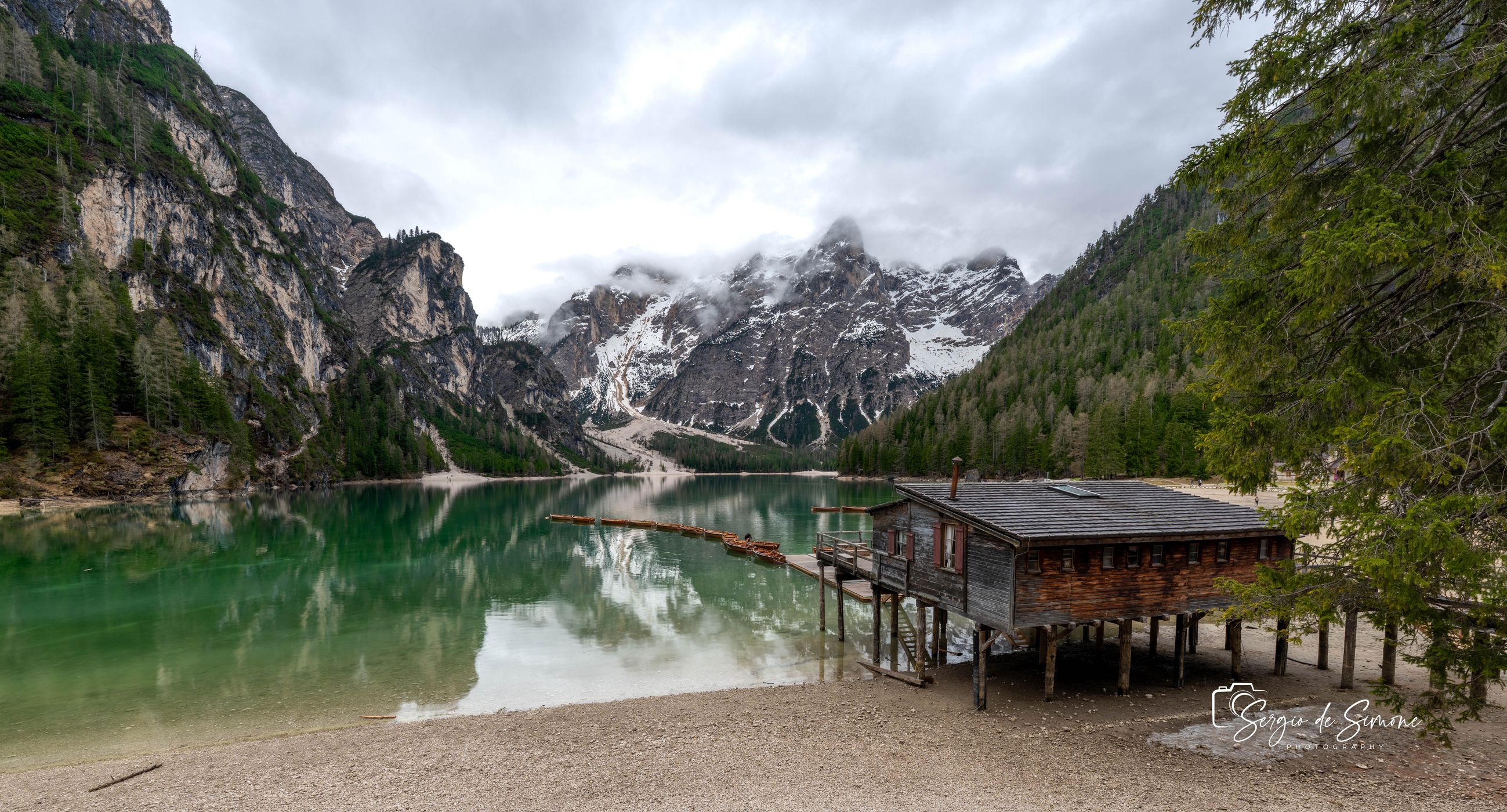 Wooden house on Lago Braies in Dolomites, Italy