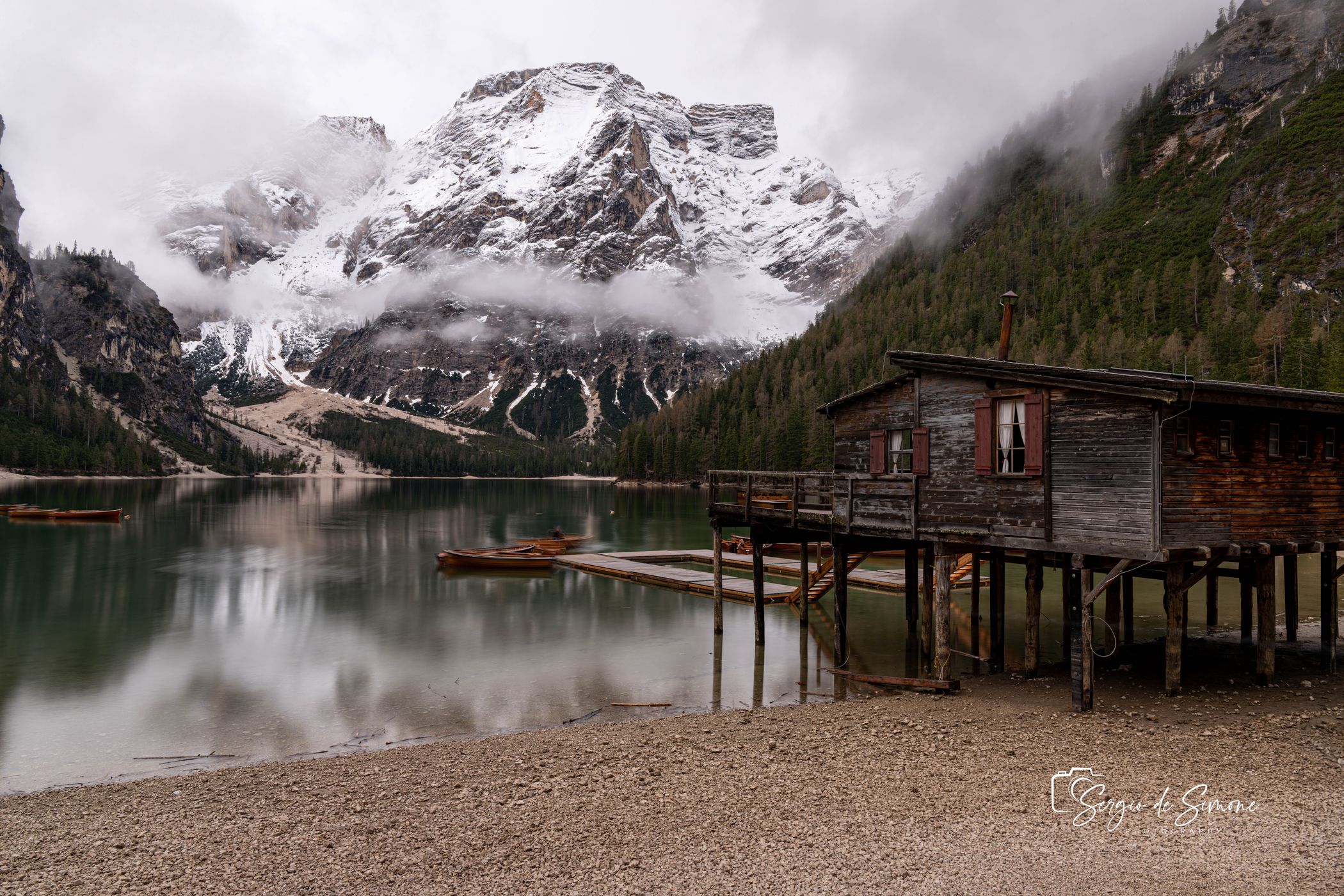 Wooden house on Lago Braies in Dolomites, Italy