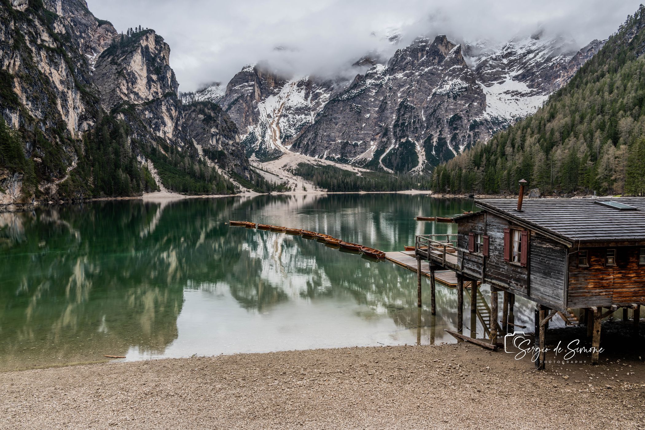 Wooden house on Lago Braies in Dolomites, Italy