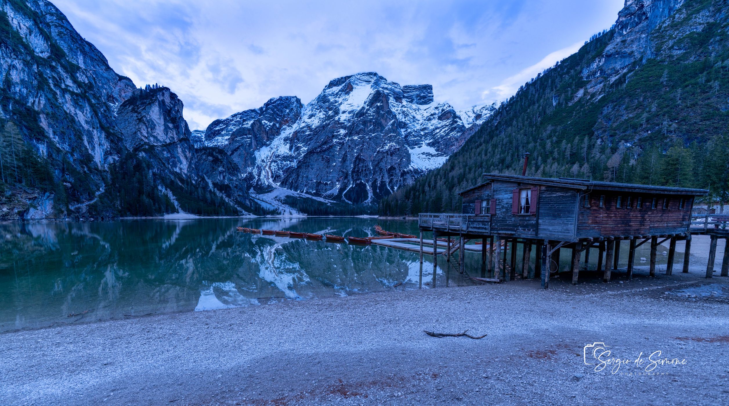 Wooden house on Lago Braies in Dolomites, Italy