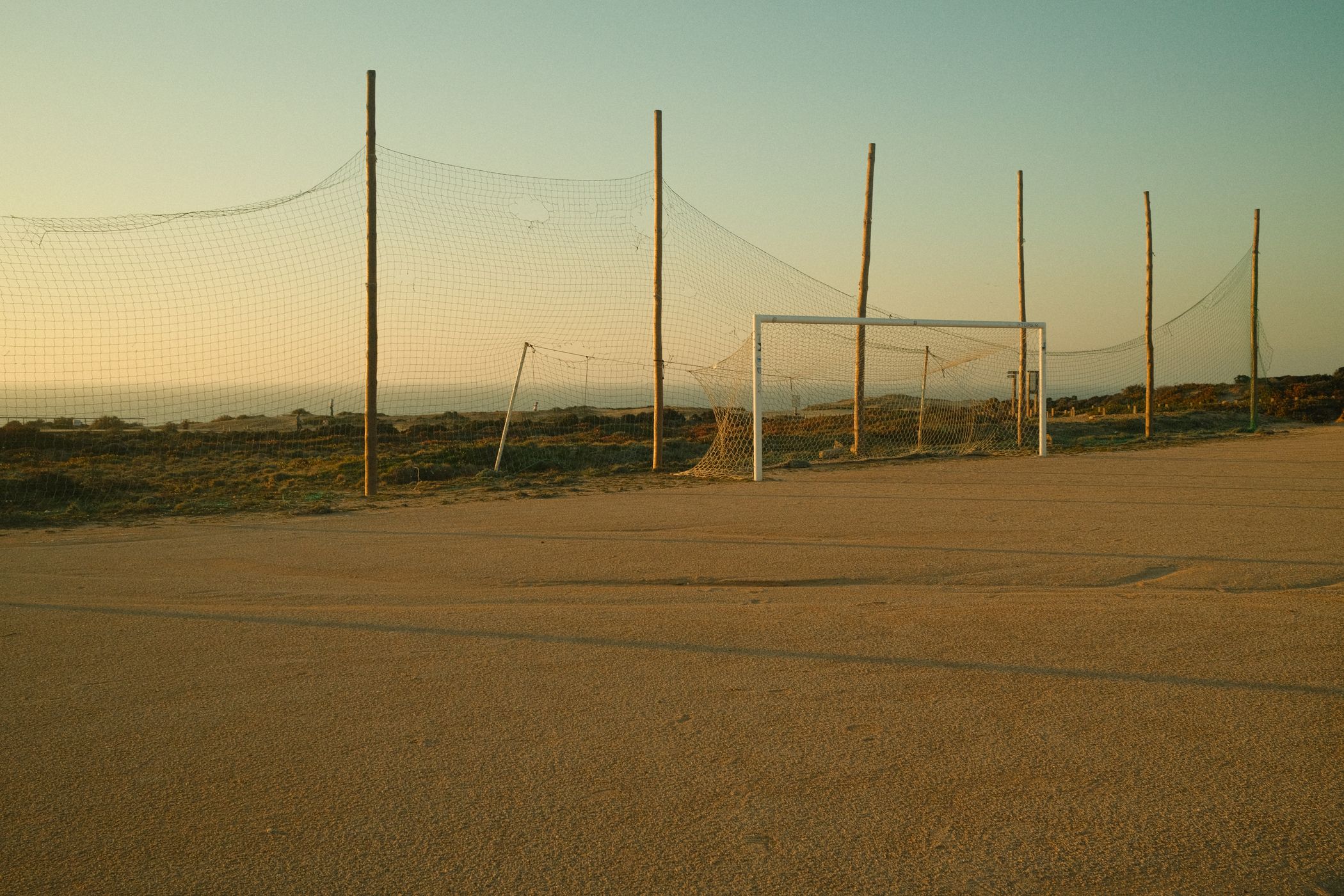 Soccer pitch next to lighthouse Farol do Cabo Sarda, Portugal